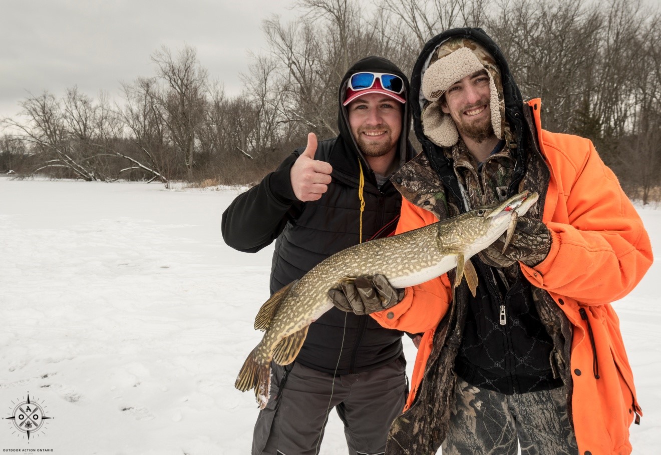 Avid Ice-anglers Andrew Allore and Matthew Heayn are shown with the fruits of their labour – a gorgeous Ontario Northern Pike.